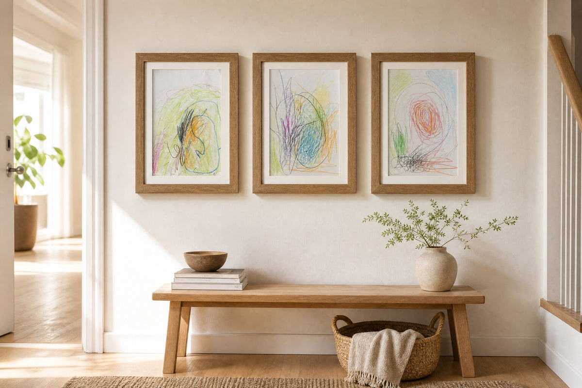 Three PeekDoodle frames above a hallway bench